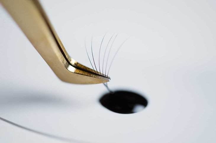 Eyelash extensions in the beauty salon. The concept of body care and beauty.