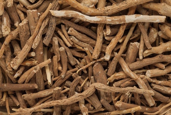 Organic Ashwagandha (Withania somnifera) roots. Macro close up background texture. Top view.