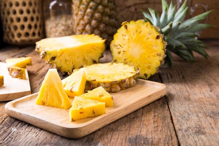pineapple on the wooden texture background