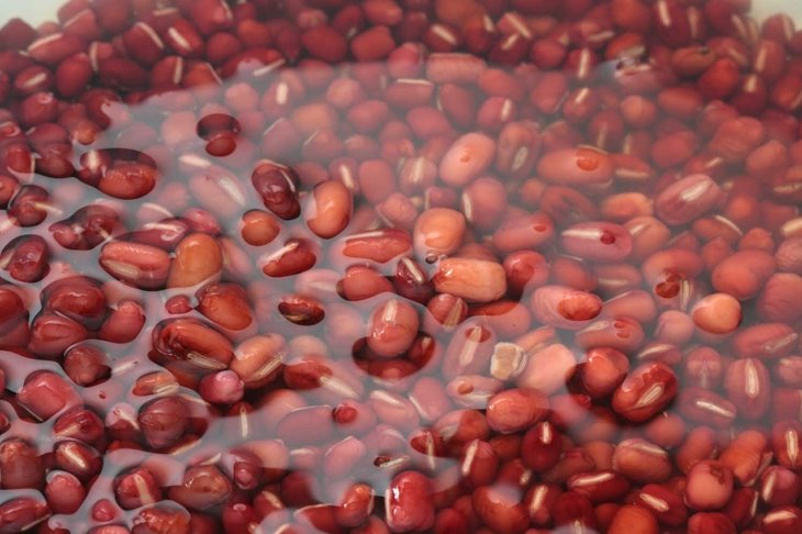 Close up of red beans soaked in water