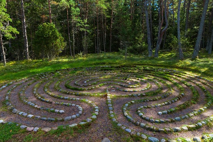 Mystic oriental stone labyrinth in green forest, aestetic symbol