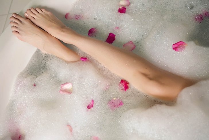 pink rose petals in a round tub with legs girls